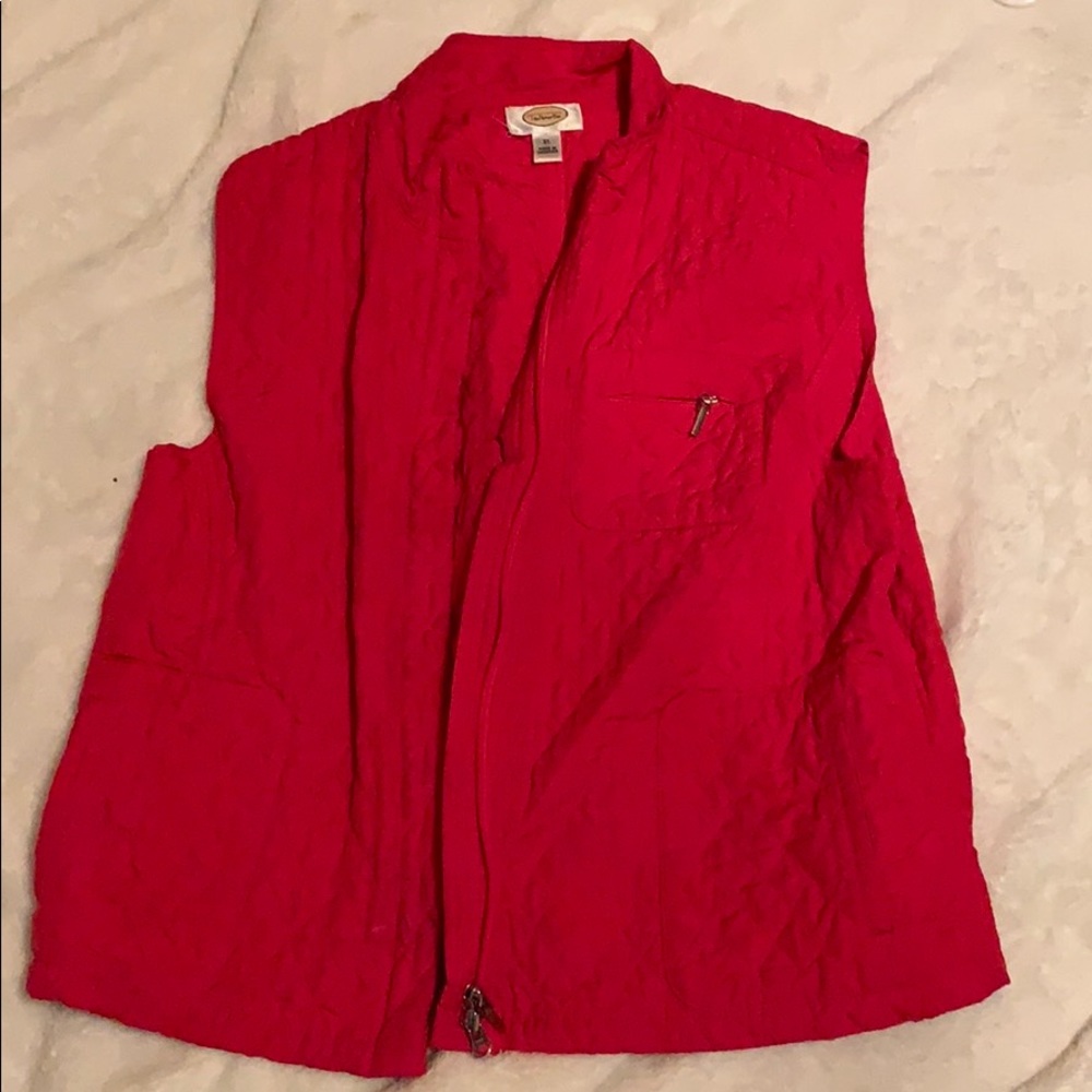 A pink/ reddish vest